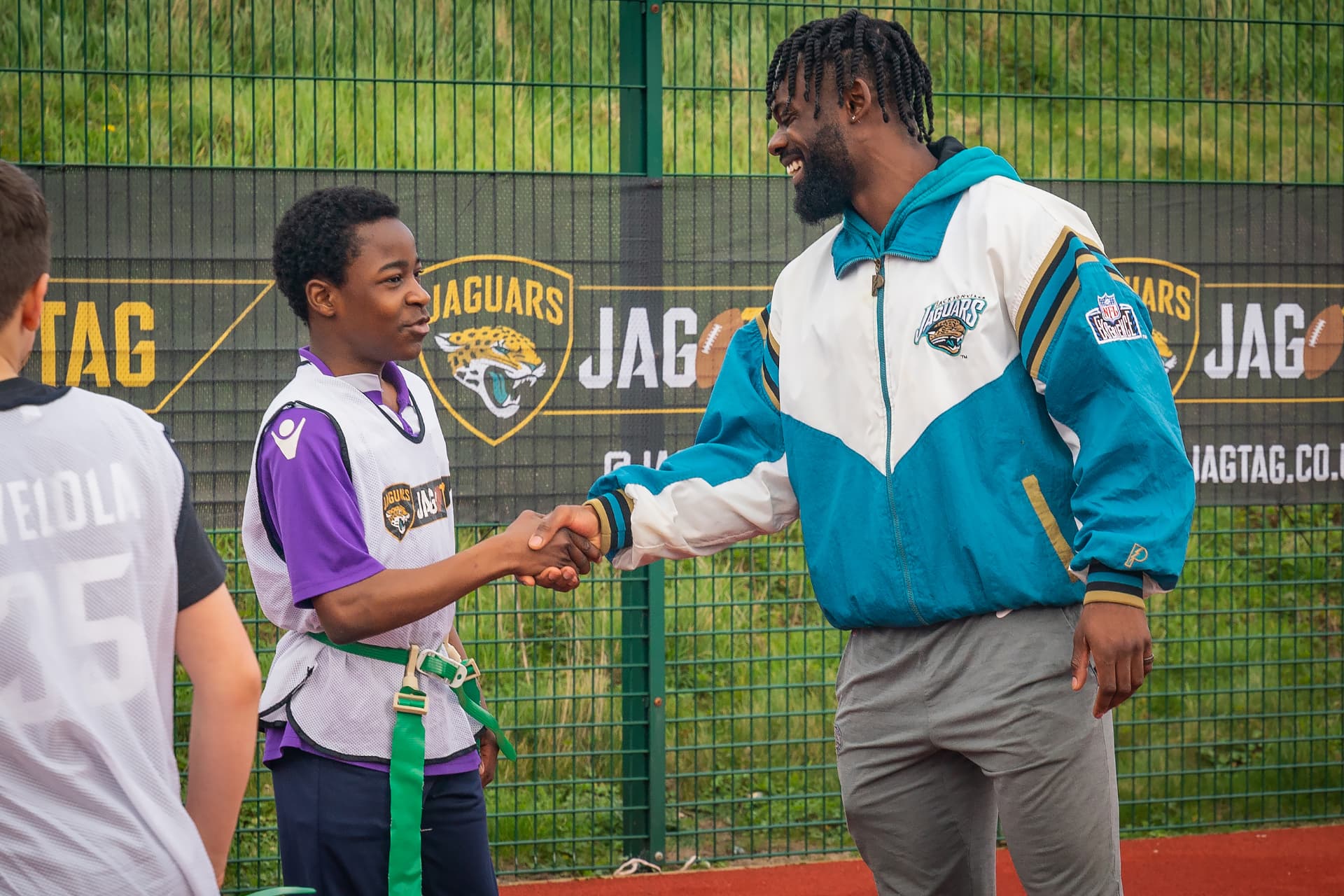 Greeting a player at a JAG TAG flag football session